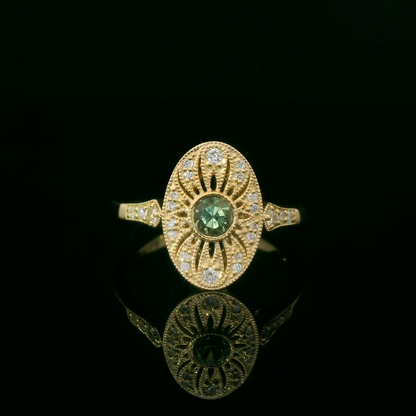 Elegant Gold Ring with Green Gemstone
