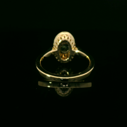 Elegant Gold Ring with Green Gemstone