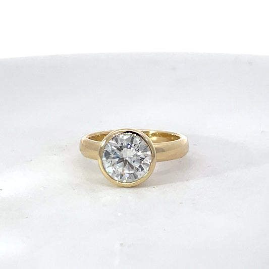Elegant Gold Ring with Custom Bezel Set Diamond