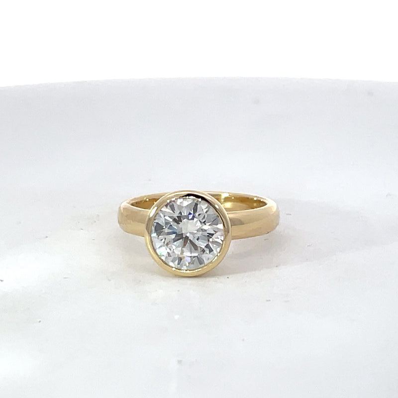 Elegant Gold Ring with Custom Bezel Set Diamond