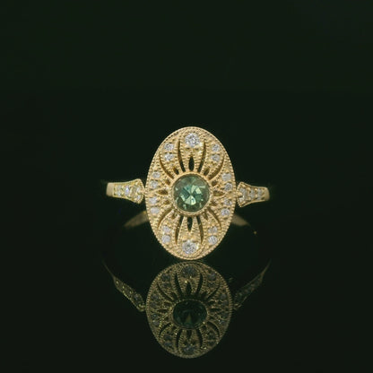 Elegant Gold Ring with Green Gemstone