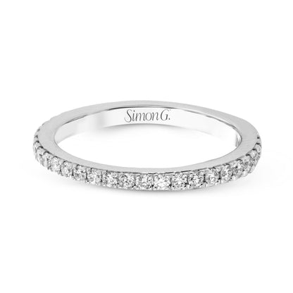 Round-cut Halo Engagement Ring & Matching Wedding Band in 18k Gold with Diamonds